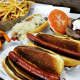 Dogs are made with 100 percent Black Angus beef at The Filling Station and its sister restaurant, T.F.S. Burger Works.