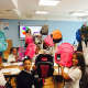 Students at Atmosphere Academy with their new backpacks.