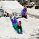 Kids enjoying snow banks on Marathon Place in Port Chester.