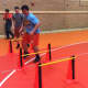 Athletes perform lateral jumps before partnering up at practice Monday.