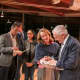 Retired U.S. Gen. Wesley Clark signs copies of his latest book after a talk in New Canaan.
