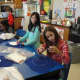 Irvington Middle School sixth-graders hand-stitched cartoon pillows in Teresa Hunt’s home and careers class.