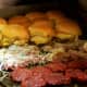 Here's a grill-full of burgers in the works at White Manna.