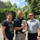 Lysa DeLaurentis (Garfield's animal control officer), Leonia Police Sgt. Chris Garris and Detective Michael Jennings with Maggie.