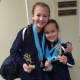 Darien YMCA Level 3 gymnasts Megan Hayes and Alexandra Kuras celebrated their success with smiles after the Snowflake Invitational.
