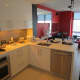 The kitchen in a three-bedroom apartment at "The Modern."