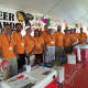 Several volunteers pose for a photo inside the craft beer tent at the Oyster Festival Saturday.