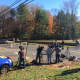 Media wait near the house on Norfield Road where police found what may be human remains