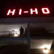 A photographer takes a photo of the crowd cheering as the Hi-Ho sign is lit again Tuesday night.