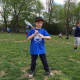 A young lacrosse player readies for a catch.