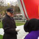Stamford Mayor David Martin became a balloon handler at Thursday's press conference for the UBS Parade Spectacular. 