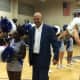 Longtime Teaneck basketball coach Curtis March walks through a wave of supporters at a court-naming ceremony in his honor Thursday, Jan. 7.