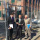 State Rep. Chris Perone, State Sen. Bob Duff and Norwalk Mayor Harry Rilling outside the mill building that will be renovated to become the SoNo Life Center.
