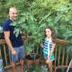 Michael Fanelli with one of his daughters and his beloved fig trees.