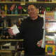 Lewis Stern holds up a Powerball ticket at Yorktown Wine and Liquors.