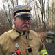 New Canaan Fire Chief Jack Hennessey at the scene of Friday's fire at 610 Cheese Spring Road.