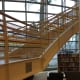 Artist Katherine Daniels created an art installation of colorful plastic strips woven into the gridded surround of Greenwich Library's grand stairs.