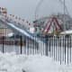 Rye Playland's snow-coated "Fun Slide"   is on slippery grounds with a new review of the county contract with Standard Amusements.