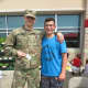 Billy Cook meets a soldier at a signing event in Connecticut on Saturday.