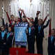 Level 5 gymnasts from the Darien YMCA accept their team champion banner at the Snowflake Invitational in Wilton.