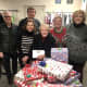 Bedford resident Glenn Close and colleagues provide donations to families in need during the holiday season