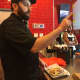 Juicy Platters owner Jaffar Wahdat "digs deep" Wednesday at work in Hackensack.