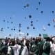 Students toss mortarboards concluding the Irvington High School’s Class of 2016 June 18 commencement ceremony at Matthiessen Park.