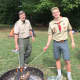 Scoutmaster Kevin Granath and Life Scout Jimmy Terhune roast marshmallows