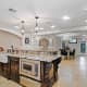 The gourmet kitchen features a large granite island, high-end appliances and a wine cellar via a butler's pantry, Pais said.