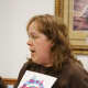 Jane Sparling leads a group of moms through a game of Momsense at a monthly meeting.