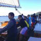 Irvington students help crew members haul on the lines as they sail the Hudson River aboard the sloop Clearwater.