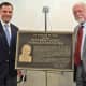 Dutchess County Executive Marcus J. Molinaro, left, and Dr. Kenneth M. Glatt, former county commissioner of mental hygiene, unveil a plaque honoring Glatt at the county's new stabilization center.