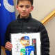 Nicolas Lewis was honored by the mayor and council for his winning poster.