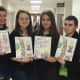 Shannon Stemper, Andie Bigos, Carlie Rein, Kayla Vincent, Nicole Mofrad, Andrew Favorito, Alexandra Capodicasa, Sara Takubo and Marianna Maltsev display their children's book "Lily the Learner"