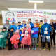 Winners of each age category of the 5K Run pose for a photo.
