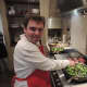 Nick Evarts learns to sauté at the cooking class.