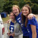 Emmanuel’s teen parishioners, Grace Juneau, Lily Butt and Claire Magee, from left, at last year’s fair in Weston.