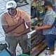 Two of the suspects cashing stolen scratch-off lottery tickets.