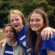 Emmanuel’s teen parishioners, Grace Juneau, Lily Butt and Claire Magee, from left, at last year’s fair in Weston.