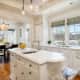 A stunning custom kitchen includes Carrara marble counters.