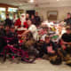 Santa and his smoke eating elves along with the toys that were collected for Toys 4 Kids by White Hills Fire Company.
