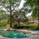 A beautiful inground pool is located in the back yard.