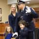 Ridgewood Lt. Heath James is sworn in accompanied by his wife and children.