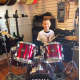 Chris Grant studies drums and he is doing some singing lessons to prepare him for the audition of "School of Rock."