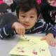 A youngster makes a Valentine's Day card at the Leonia Library.