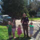 Kids enjoy talking to Bethel Police Officer Michael McKinney while he drinks a cup of lemonade.