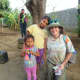 Diana Sarna making friends with some children in Nicaragua, whose home she helped to build.