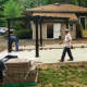 Here, pavers are being laid and the pergolas have gone up.