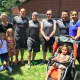 The third place Darien Police Department team with their families.