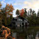 The listing features a boathouse in addition to the nearly 14,000 sq. ft. home.